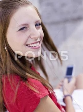 Teenage Girl Using Handy, Portrait