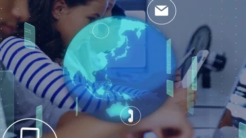 Teenage girl using tablet in computer lab, initiating globe and icons syncing to Stock Footage 335731942