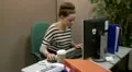 Teenage office worker answering a call HD Footage
