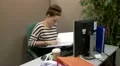 Teenage office worker checking files 1 HD Footage
