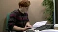 Teenage office worker checking files HD Footage