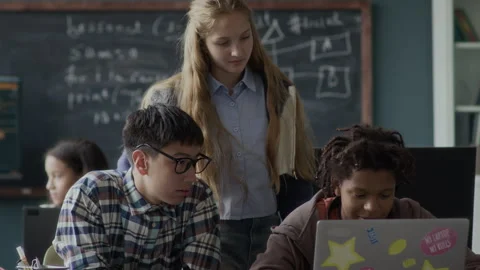 Teenage Schoolkids Studying Programming Together in Classroom Stock Footage 284431004