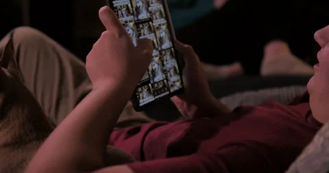 Teenage siblings conversing while on tablets. Video stock 140268169