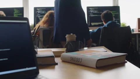 Teenage Students Writing Code on Computers in Class and Teacher Watching Stock Footage 278127972