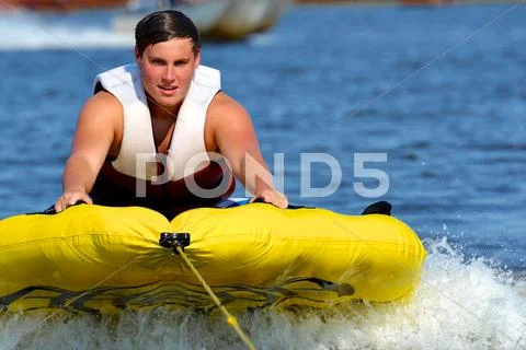Teenage Tuber Getting Started on His Run Stock Photos