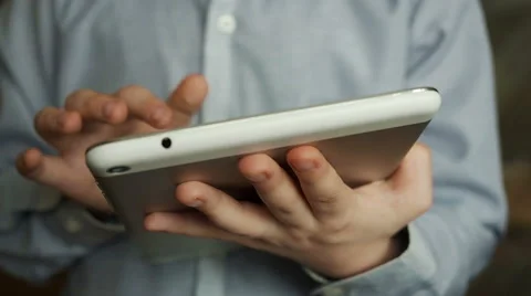 Teenager boy using touch pad. Entertainment with tablet PC Stock Footage 61356032