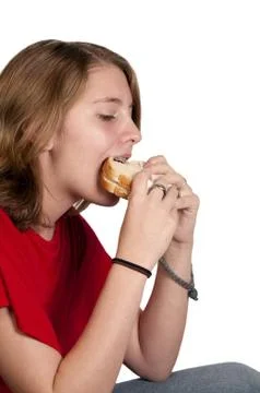Teenager with Braces Eating a Sandwich Stock Photos