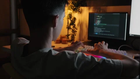 Teenager Coding on Computer in Dark Room at Night 库存影片 344967745