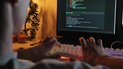 Teenager Coding on Computer Keyboard at Night 库存影片 344967805