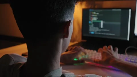 Teenager Coding on Computer at Night 库存影片 344967756