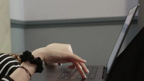 Teenager cracking knuckles while looking at laptop screen Stock Footage 310869038