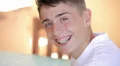 Teenager with dental appliance looking at camera (portrait) HD Footage