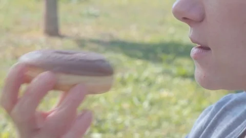 Teenager eats donut Stock Footage 81542058