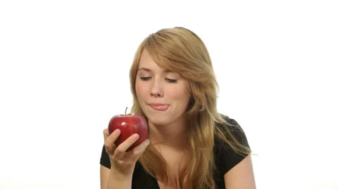 Teenager girl eating an apple Stock Footage