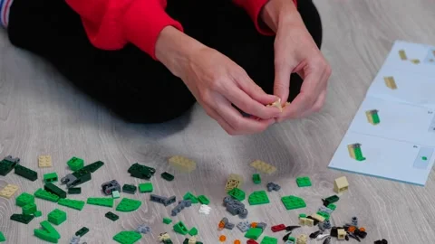 Teenager with hands constructs elements from back view Stock-Footage 160592185