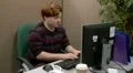 Teenager having computer problem in the office HD Footage