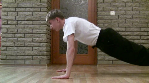 Teenager making pushups. Stock Footage