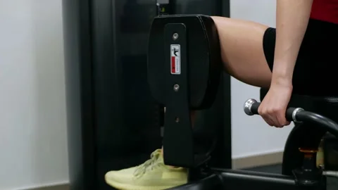 Teenager performs exercise on simulator. Gym, muscles on back. treatment of Stock-Footage 162943404