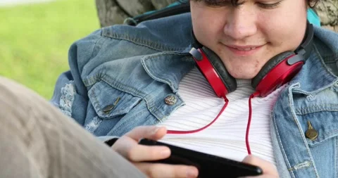 Teenager with pimples on face using smartphone 6 Stock Footage 147982575