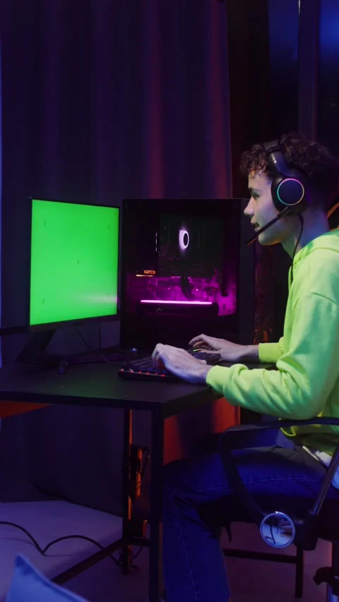A teenager plays computer games while sitting in. Stock Footage 318943401