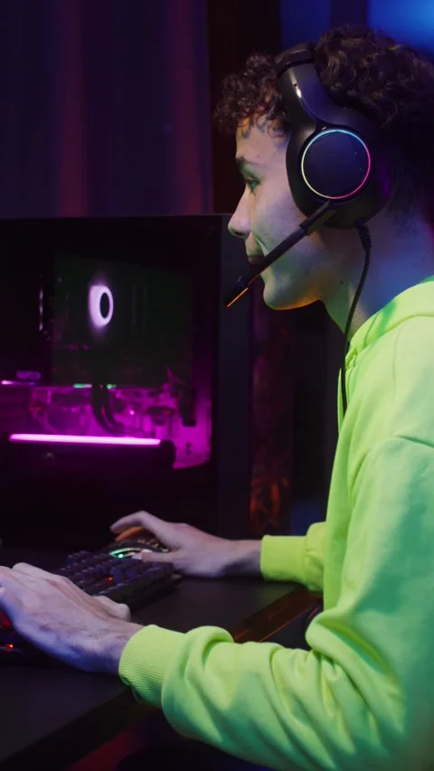 A teenager plays computer games while sitting in. Stock Footage 318943405
