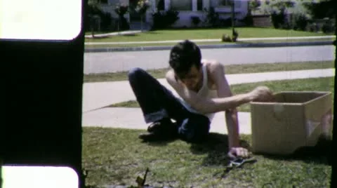 Teenager PULLS WEEDS Yard Work Lawn Chore 1960s Vintage 8mm Film Home Movie 6064 스톡 동영상 12647192