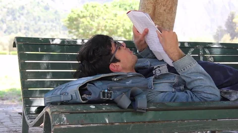 Teenager Reading On Bench Stock Footage 75806790