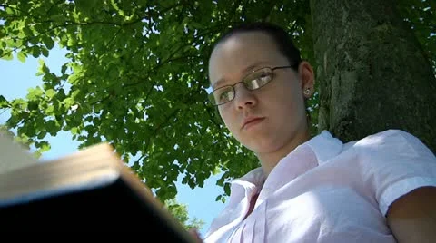 Teenager reading Stock Footage 22637726