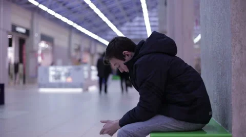 Teenager sitting on a bench and drinking lemonade Stock Footage 59558732