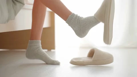 Teenager in slippers quickly goes to bed Stock Footage 221229853