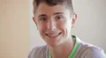 Teenager smiling and showing his dental appliance HD Footage