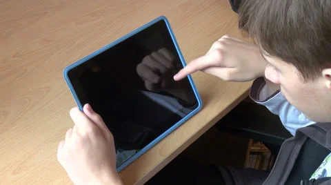 Teenager studying math on a tablet PC, student using a learning device Stock Footage 31211682