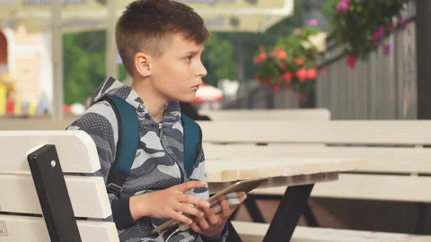 Teenager with Tablet Computer in Cafe Stock Footage 94333352
