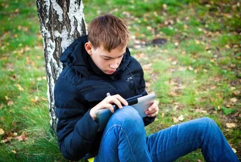 Teenager with Tablet Computer Stock Photos