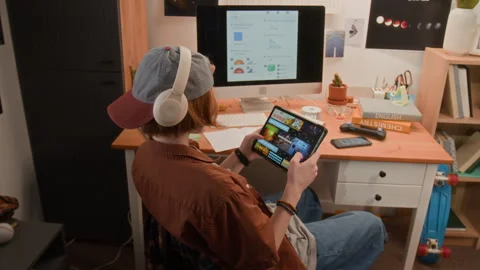 Teenager Using Digital Tablet and Computer for E-learning Stock Footage 340775551