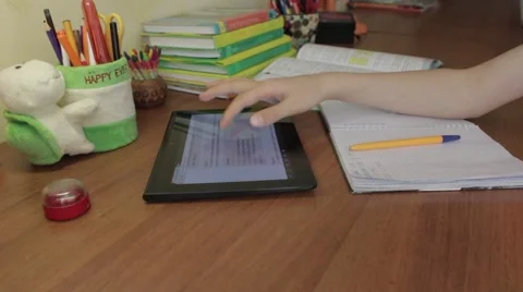 Teenager using a digital tablet work on a homework assignment. 스톡 동영상 49909161