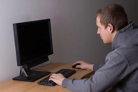 Teenager using a personal computer Stockfoto's