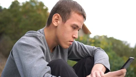 Teenager using a smartphone Stock Footage 97629231