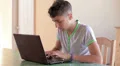 Teenager writing on his personal notebook HD Footage