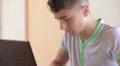 Teenager writing on his personal notebook HD Footage