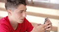 Teenager writing messages on the smartphone HD Footage