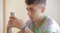 Teenager writing messages on the smartphone HD Footage