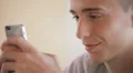 Teenager writing messages on the smartphone HD Footage