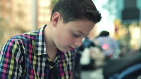Teenager writing notes in notebook, doing homework in the city HD Stock Footage 31824433
