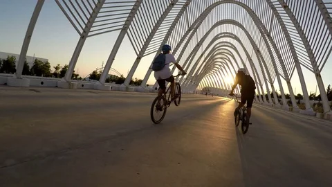Teenagers Bicycle Ride Wheelies Sunset Stock Footage