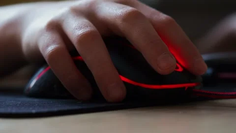 A teenager's hand with a computer mouse in close-up. Stock Footage 170651827