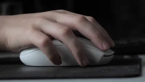 A teenager's hand with a computer mouse . Stock Footage 237744746