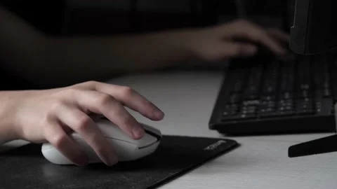 A teenager's hand with a computer mouse . Stock Footage 237744747