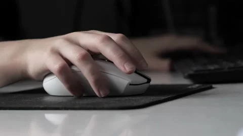 A teenager's hand with a computer mouse . Stock Footage 237744750