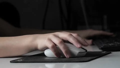 A teenager's hand with a computer mouse . Stock Footage 237744769
